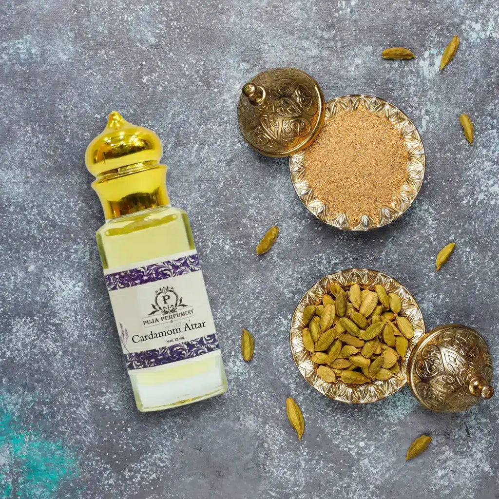 Pills of Peace Cardamom Attar with cardamom seeds and pods on a textured surface