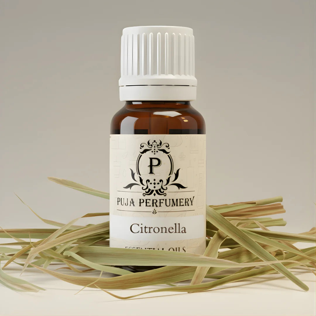 Bottle of Puja Perfumery Citronella essential oil on a neutral background with grass.