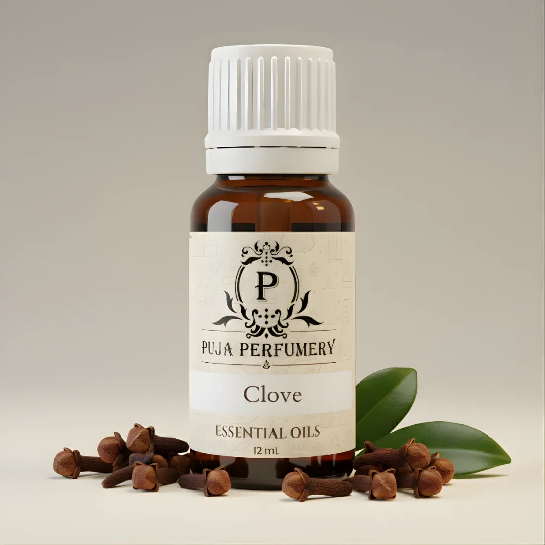 Bottle of Puja Perfumery Clove essential oil with cloves and leaves on a neutral background