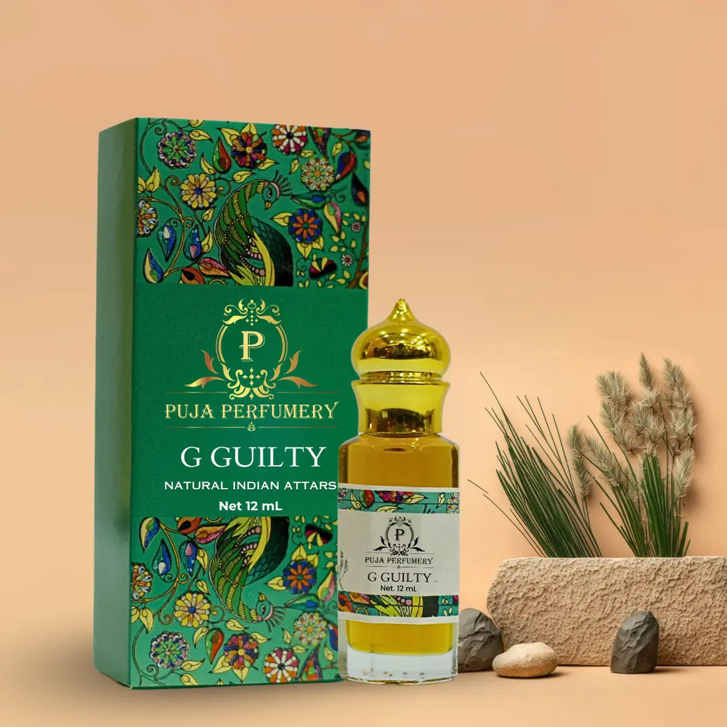 Puja Perfumery G Guilty attar bottle and packaging on a beige background