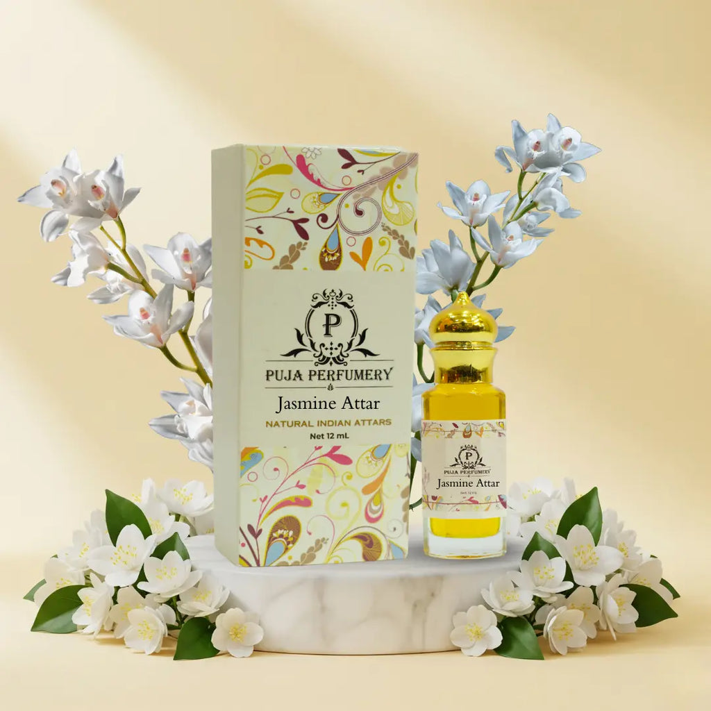 Puja Perfumery Jasmine Attar with packaging and flowers on a beige background