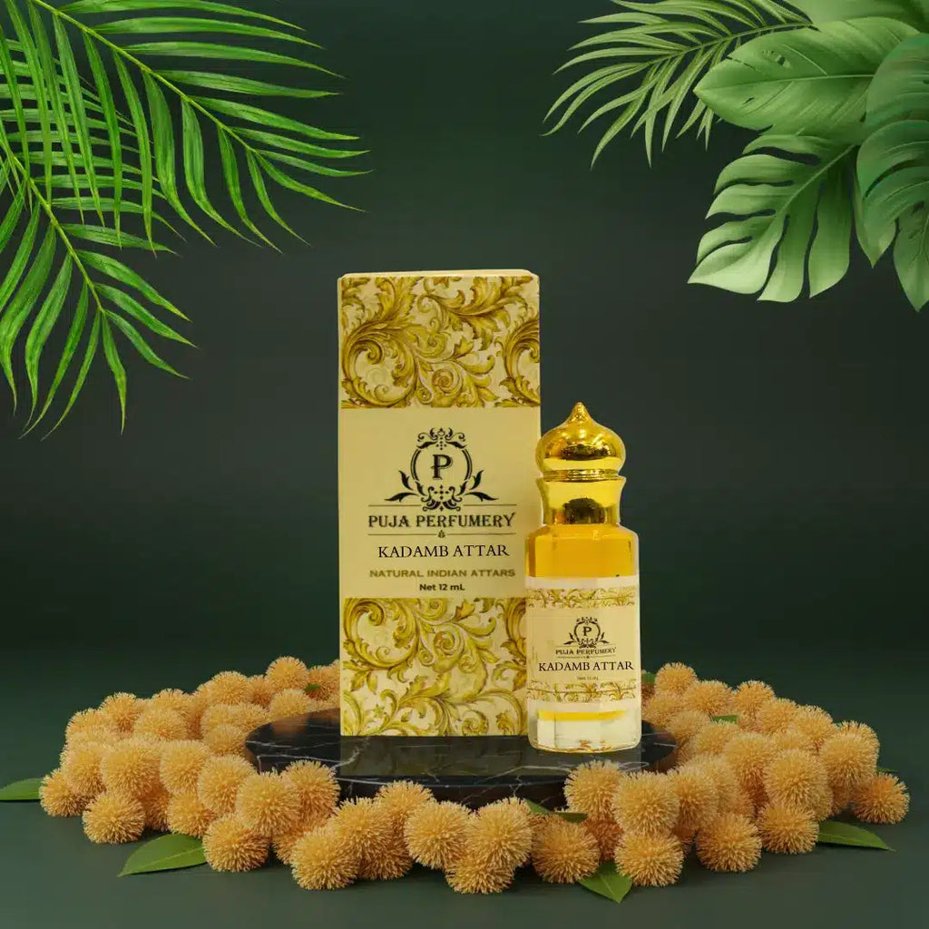 Puja Perfumery Kadam Attar bottle and packaging with green leaves in the background