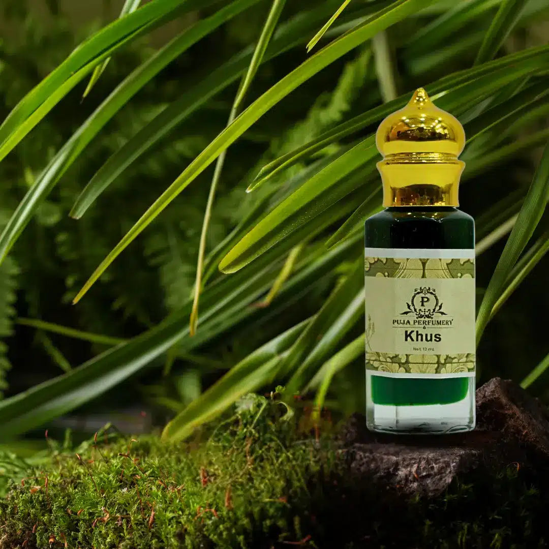 Perfume bottle labeled 'Khus' with a gold cap on a natural background