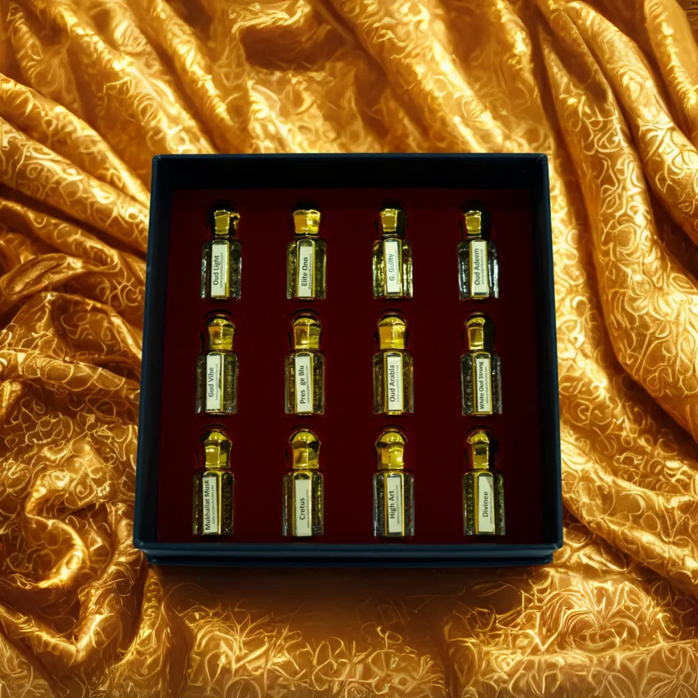 Set of small bottles in a box on a textured orange fabric background