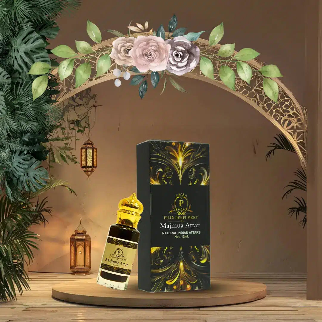 Pura Perfumes Majmu'a Attar perfume bottle and packaging on a decorative stand with floral arch and lanterns.
