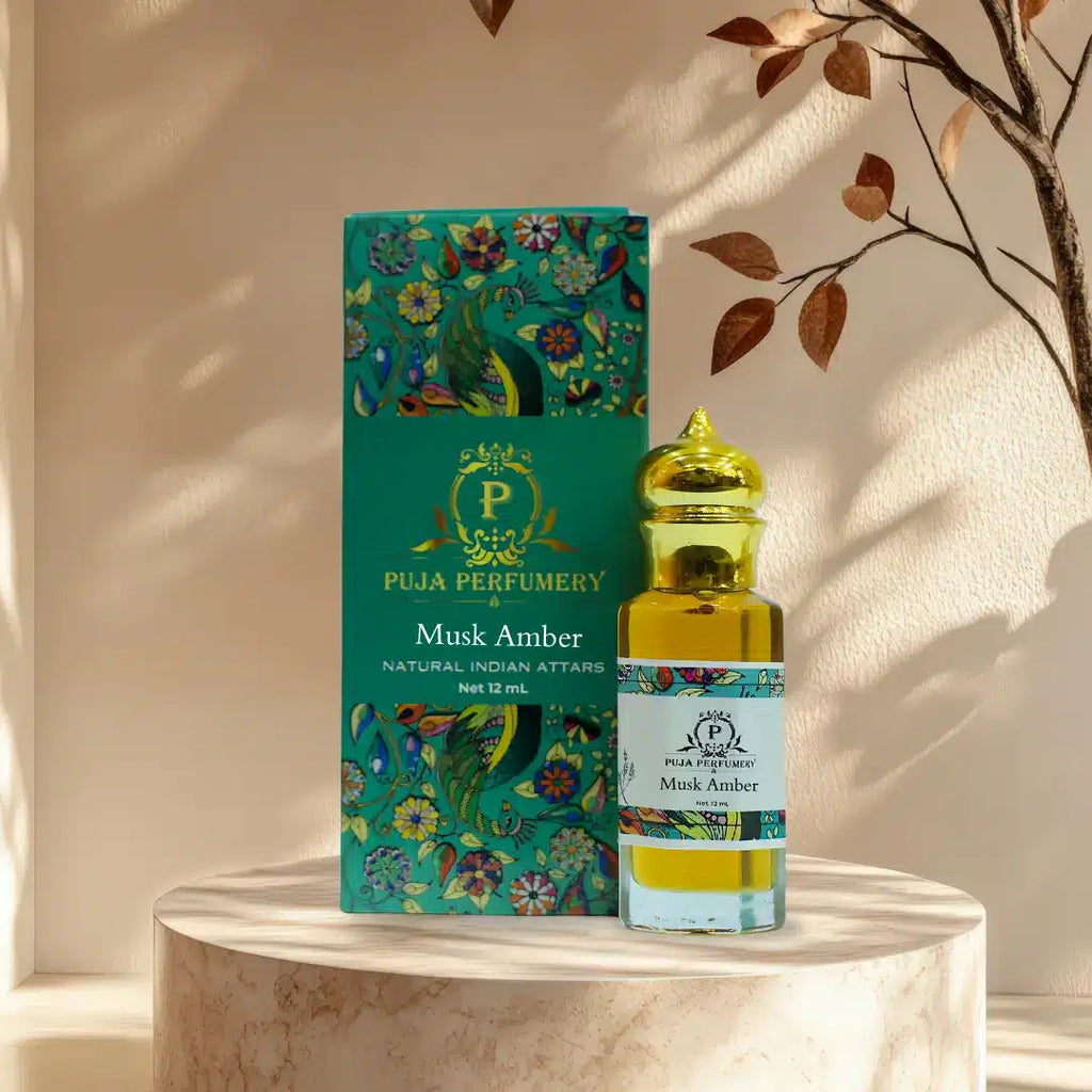 Musk Amber perfume bottle and packaging on a marble surface with a decorative background