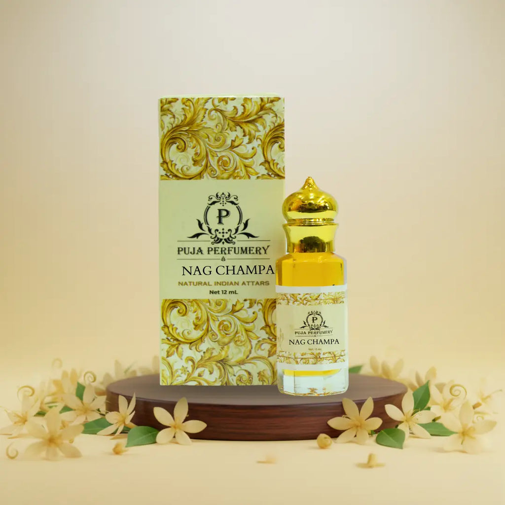 Puja Perfumery Nag Champa perfume bottle and packaging on a decorative stand with flowers.
