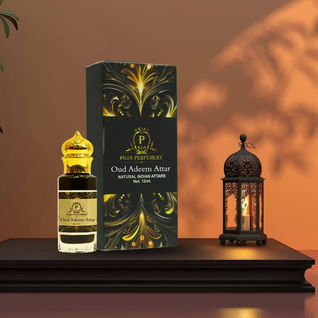 Pulia Perfumery Oud Adem Attar with packaging and a lantern on a wooden surface.
