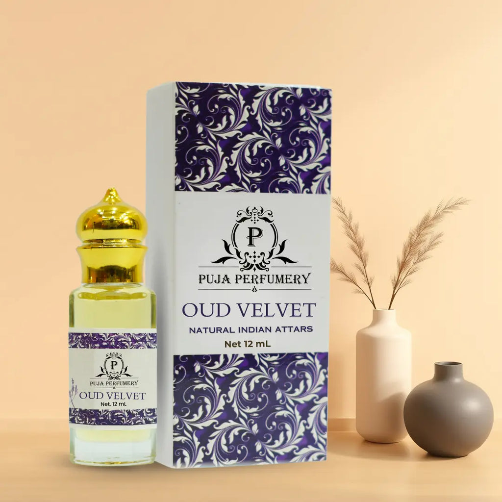 Oud Velvet attar bottle and packaging with decorative vases on a beige background