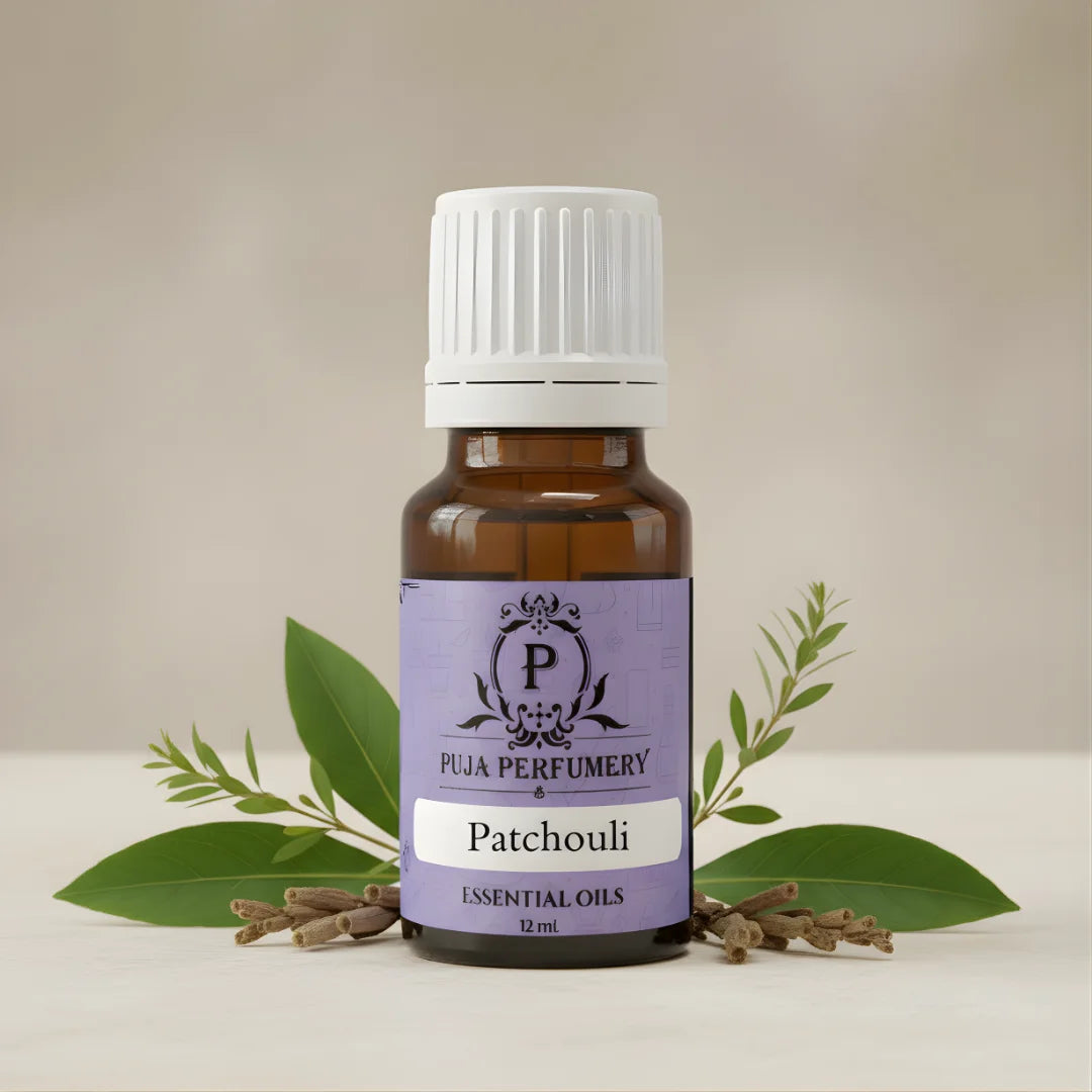 Patchouli essential oil bottle with leaves on a neutral background