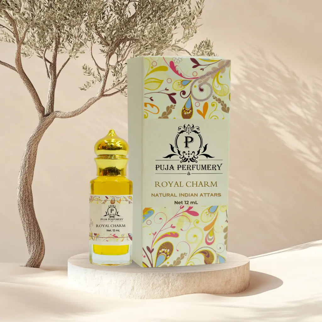 Puja Perfumery Royal Charm perfume bottle and packaging on a neutral background with a tree.