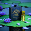 Puja Perfumery Ruh Blue Lotus product on lily pads with purple flowers