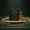 Puja Perfumery Ruh Khus Attar bottle and packaging on a dark background with grass.