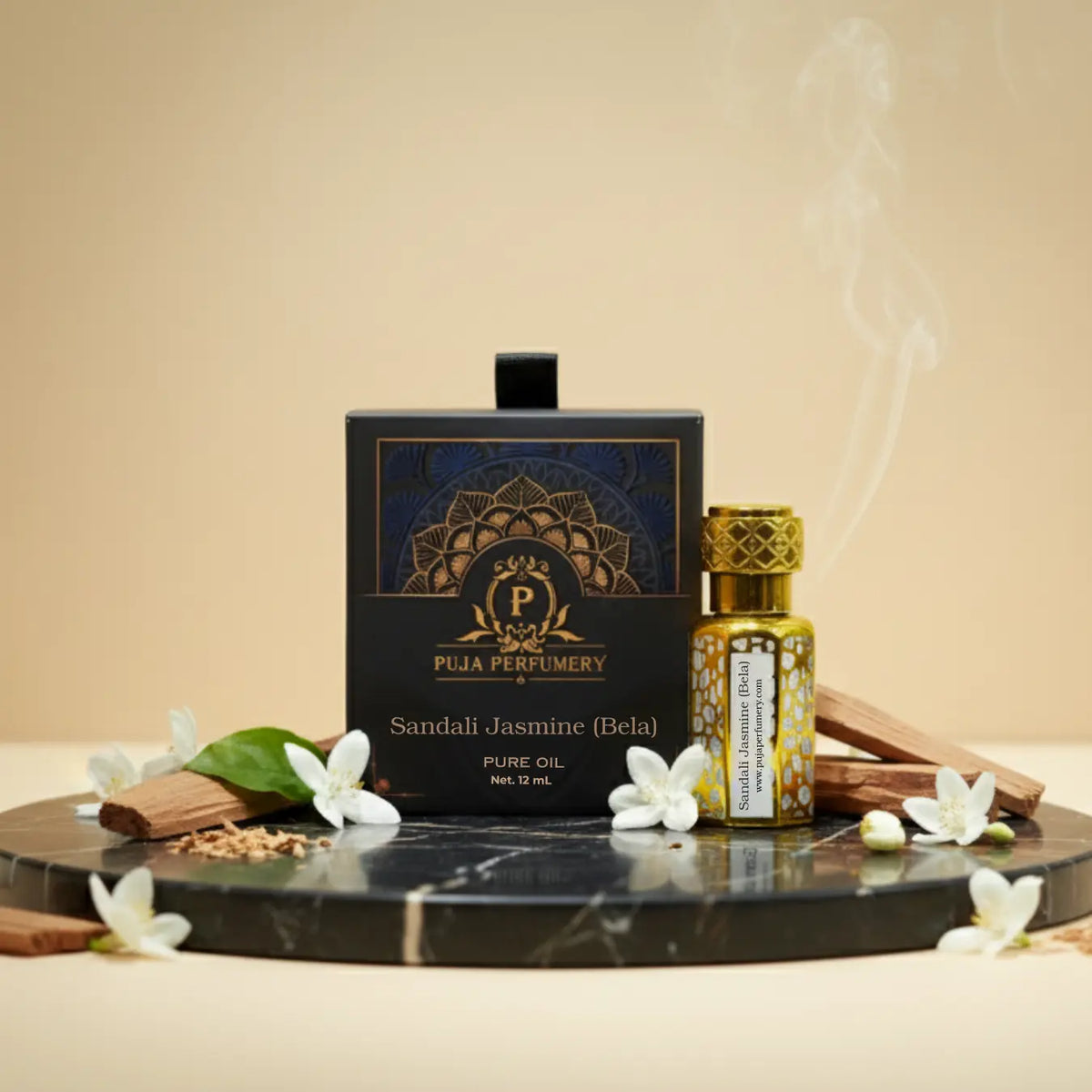 Puja Perfumery Sandal Jasmine Bela oil bottle on a decorative tray with flowers and cinnamon sticks.