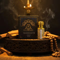 Sandalwood oil bottle and packaging with incense sticks and beads on a dark background