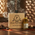 summer-oud Puja Perfumery wooden box and small bottle with smoke in the background